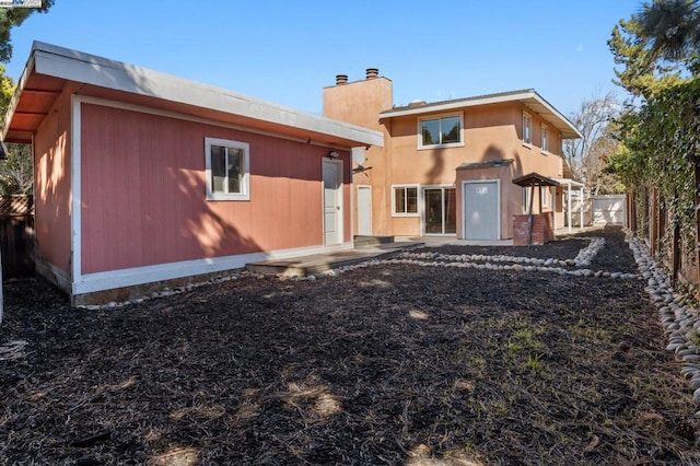 back of property featuring a patio