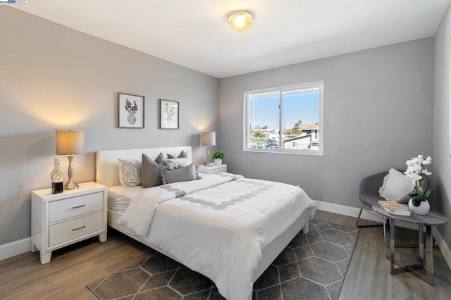 bedroom featuring dark wood-type flooring