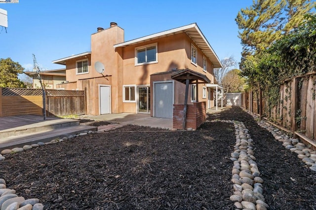 rear view of property with a patio