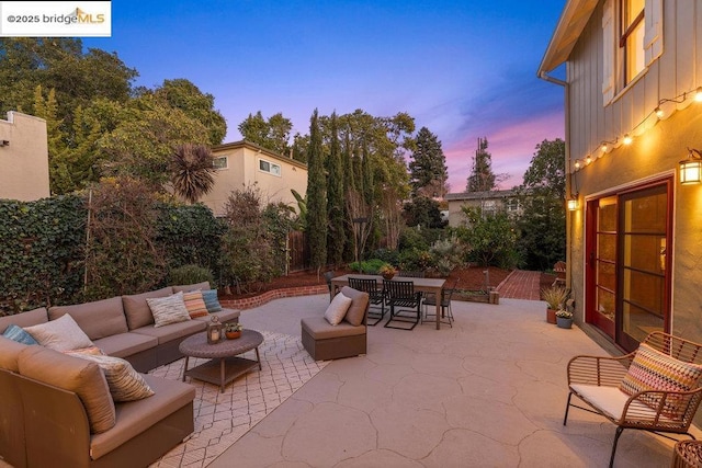 patio terrace at dusk with an outdoor living space