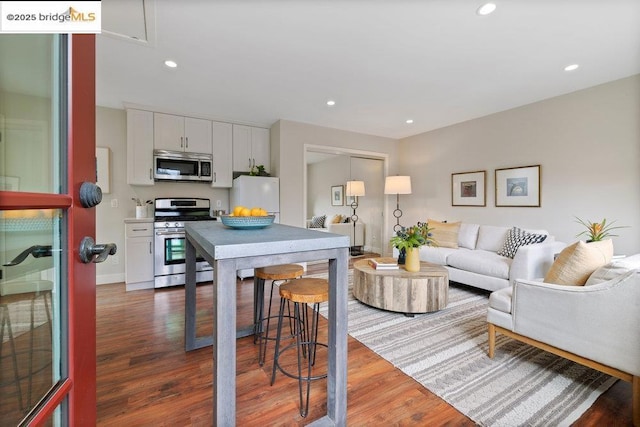 living room with dark wood-type flooring