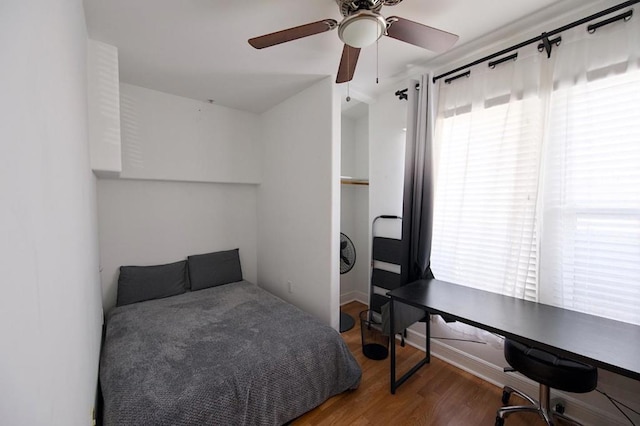 bedroom featuring hardwood / wood-style flooring and ceiling fan