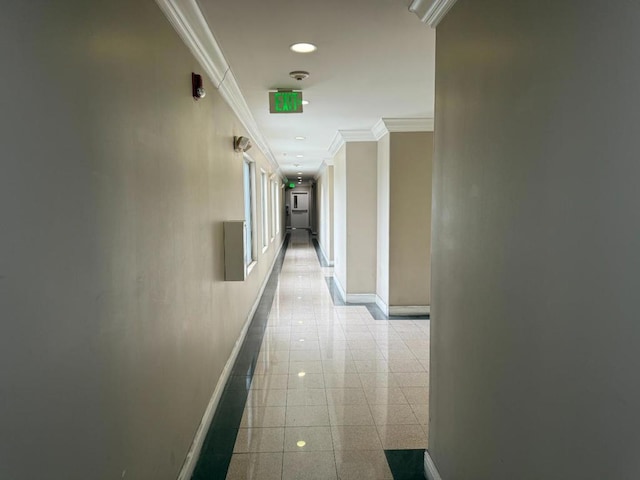 hallway featuring ornamental molding