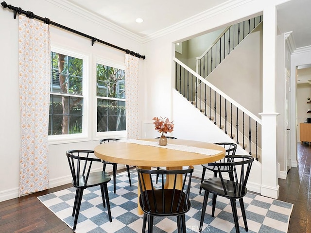 dining area featuring crown molding and dark hardwood / wood-style flooring