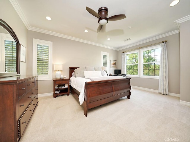 carpeted bedroom with crown molding and ceiling fan