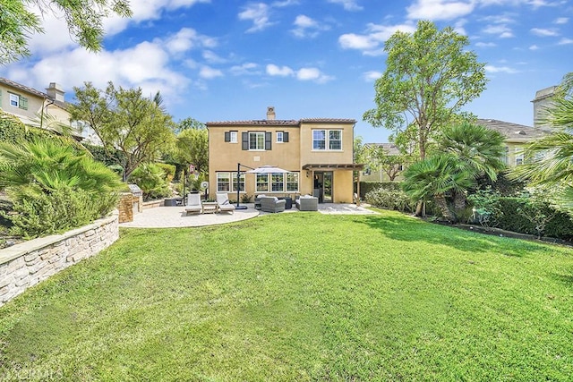 rear view of house with an outdoor living space, a patio, and a yard