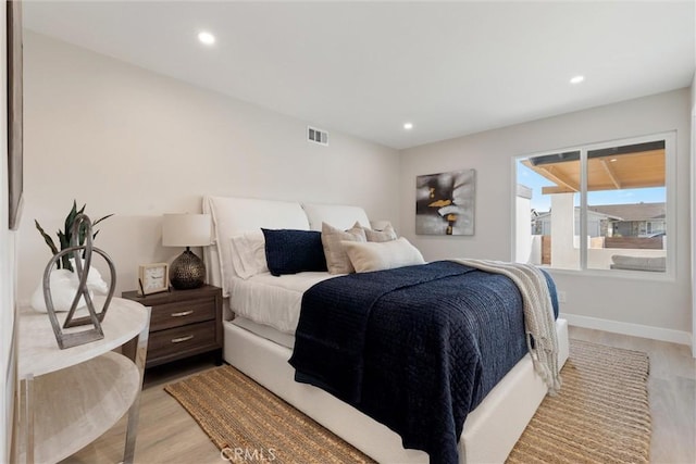 bedroom with light wood-type flooring