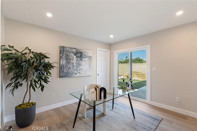 office space with light hardwood / wood-style flooring