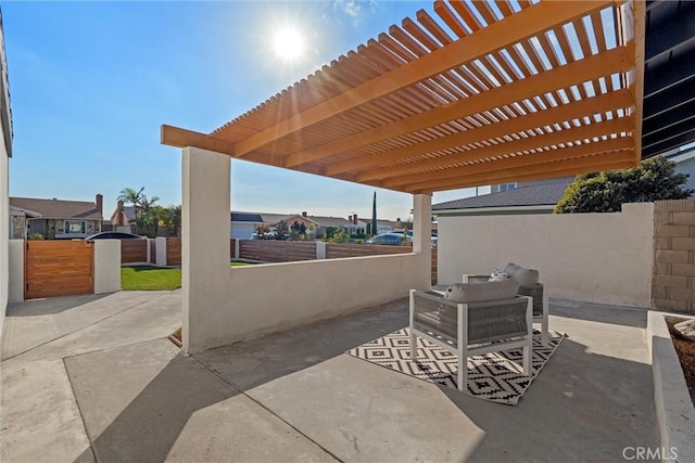 view of patio featuring an outdoor hangout area and a pergola