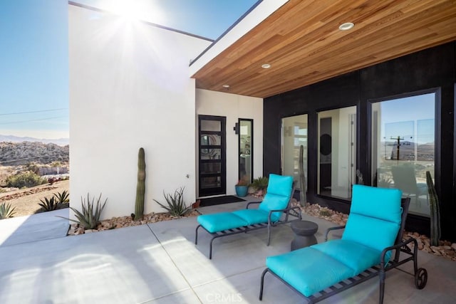 view of patio / terrace with a mountain view