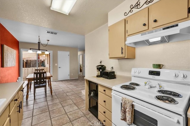 kitchen featuring decorative light fixtures, a textured ceiling, and electric stove