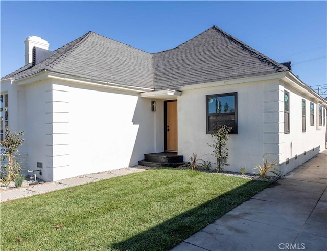 view of front of home with a front yard