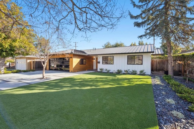 single story home with a garage and a front yard