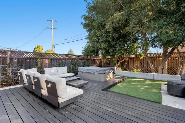 wooden terrace with an outdoor living space and a hot tub