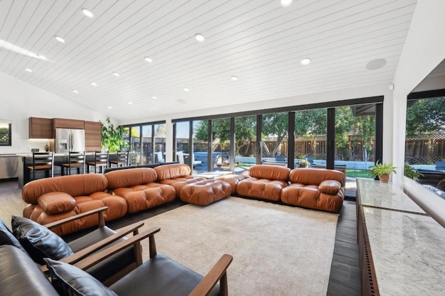 living room featuring plenty of natural light, wooden ceiling, and high vaulted ceiling