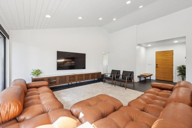 living room featuring hardwood / wood-style floors and high vaulted ceiling