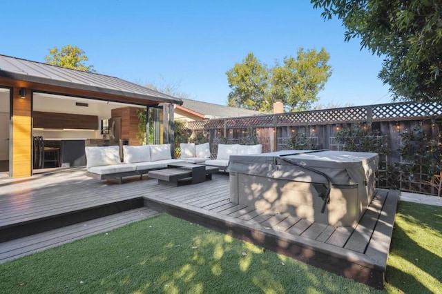 wooden terrace featuring an outdoor living space and a hot tub