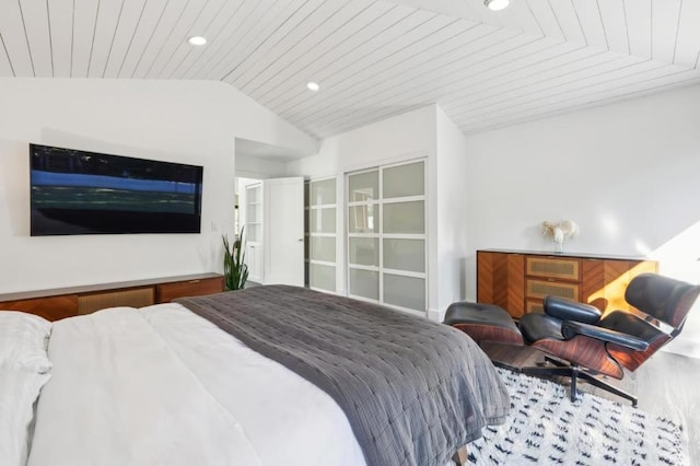 bedroom featuring vaulted ceiling and wood ceiling