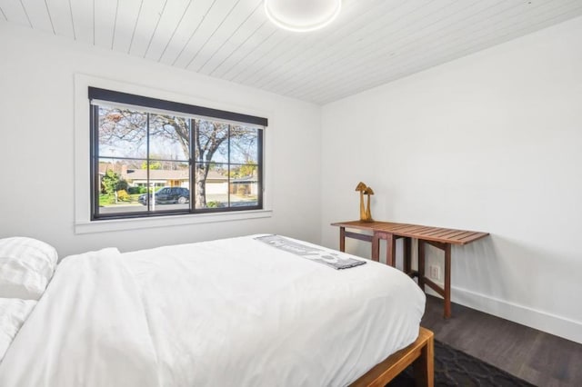 bedroom with wood ceiling and wood-type flooring