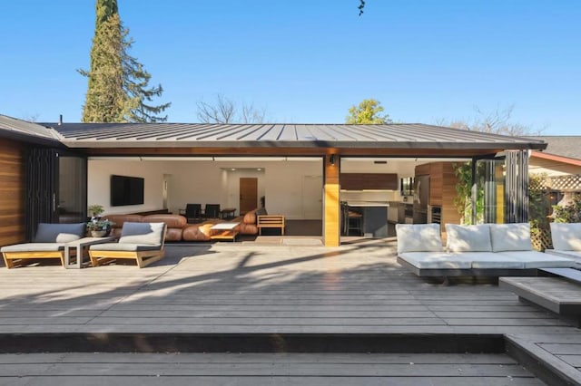 wooden deck with an outdoor living space