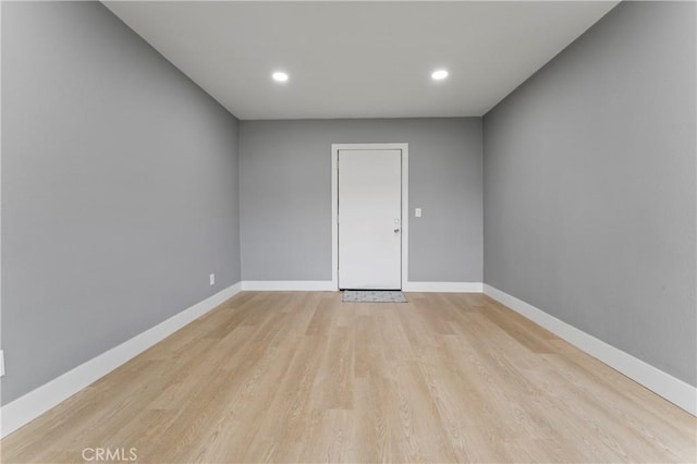 spare room with light hardwood / wood-style floors