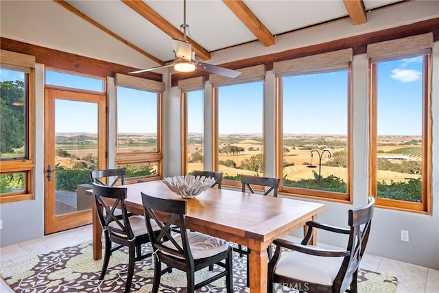 sunroom / solarium with vaulted ceiling with beams and a rural view