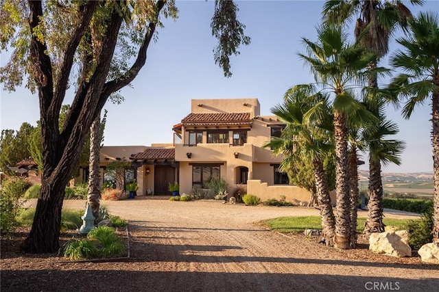 view of front of house with a balcony