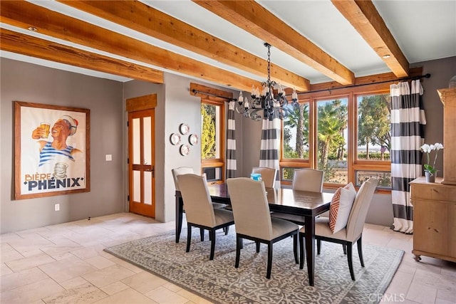 dining space with beamed ceiling, a healthy amount of sunlight, and a chandelier