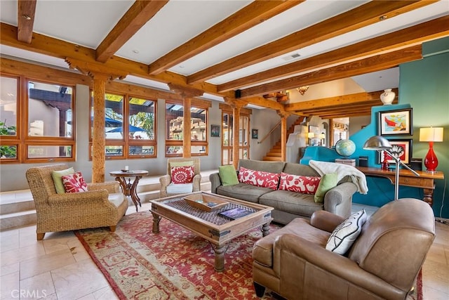 living room featuring beamed ceiling