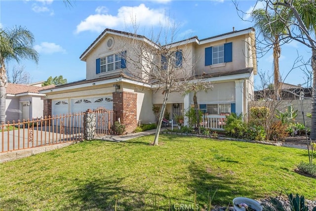 traditional-style house featuring a front yard, fence, an attached garage, and stucco siding