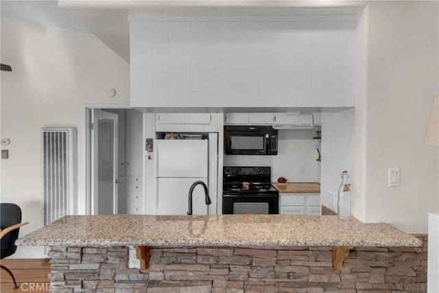 kitchen featuring white cabinetry, sink, light stone counters, and black appliances