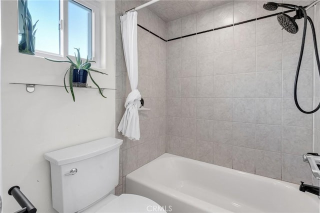 bathroom with shower / bath combo and toilet