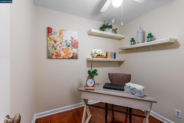 home office with dark hardwood / wood-style flooring and ceiling fan