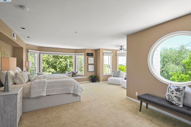 bedroom featuring light colored carpet