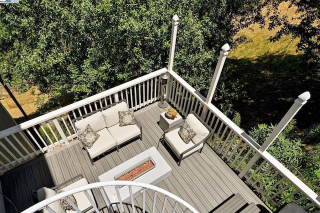 wooden terrace featuring an outdoor hangout area