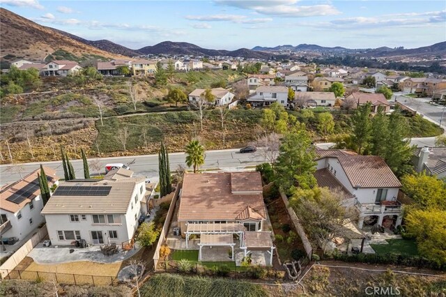 birds eye view of property with a residential view and a mountain view