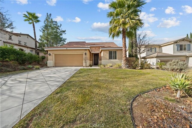 view of front of home with driveway, a tiled roof, an attached garage, a front lawn, and stucco siding