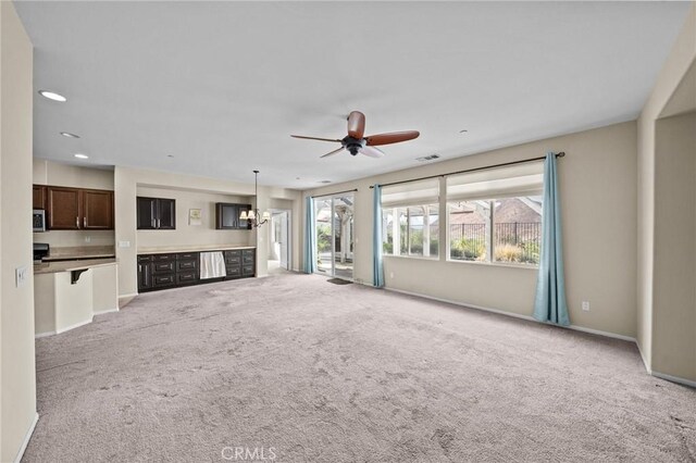 unfurnished living room featuring light carpet, visible vents, baseboards, a ceiling fan, and recessed lighting