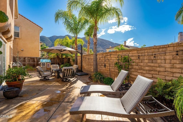 view of patio featuring a mountain view