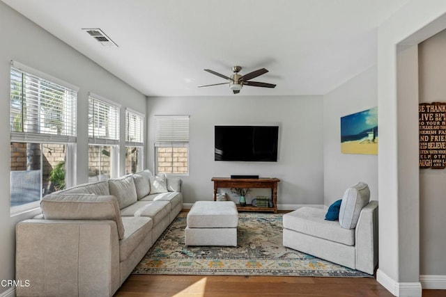 living room with ceiling fan and hardwood / wood-style floors