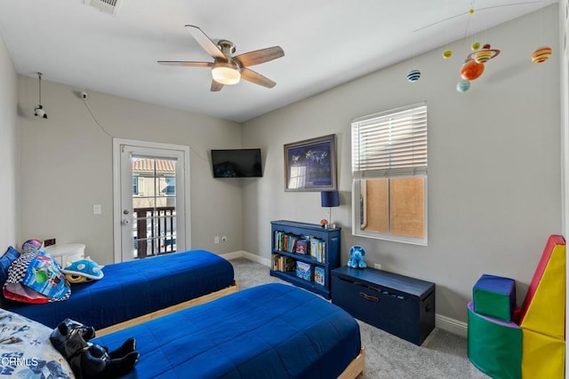 carpeted bedroom with ceiling fan and access to exterior