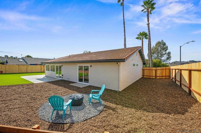 back of property featuring a patio