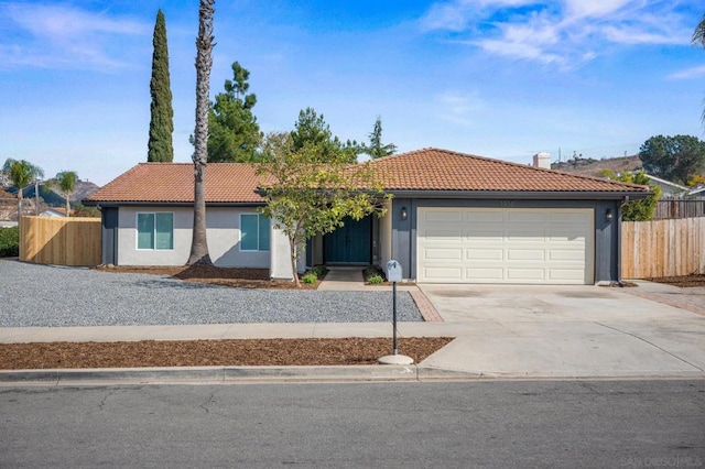 ranch-style home featuring a garage