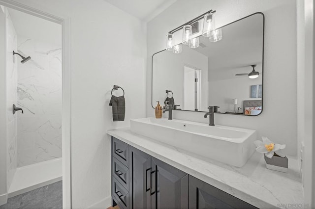 bathroom featuring vanity and a tile shower