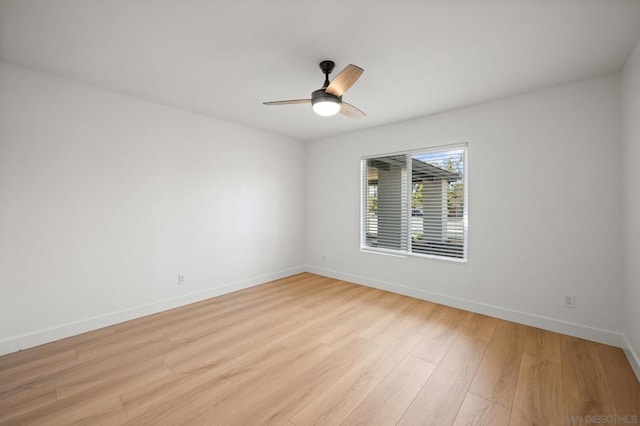 unfurnished room with ceiling fan and light hardwood / wood-style flooring