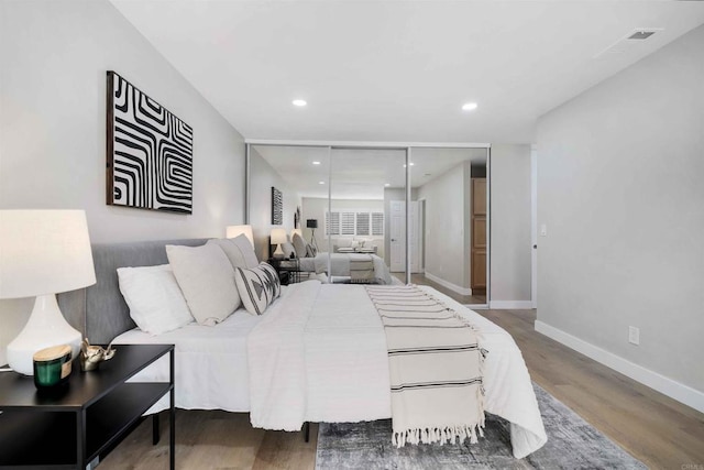 bedroom featuring dark wood-type flooring