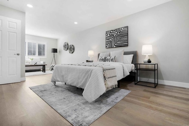 bedroom with light hardwood / wood-style floors