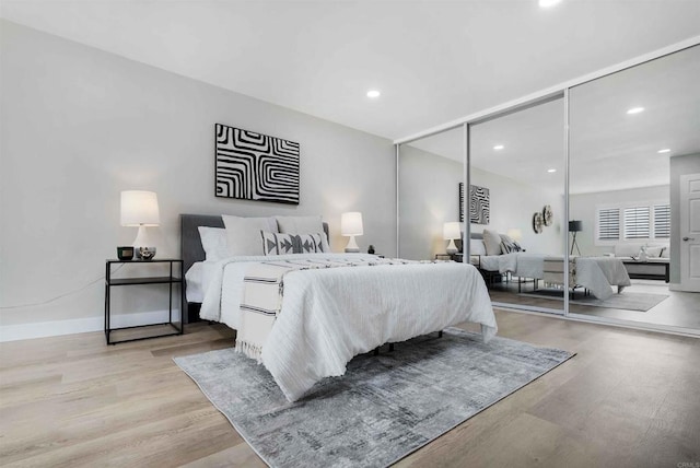 bedroom with light wood-type flooring