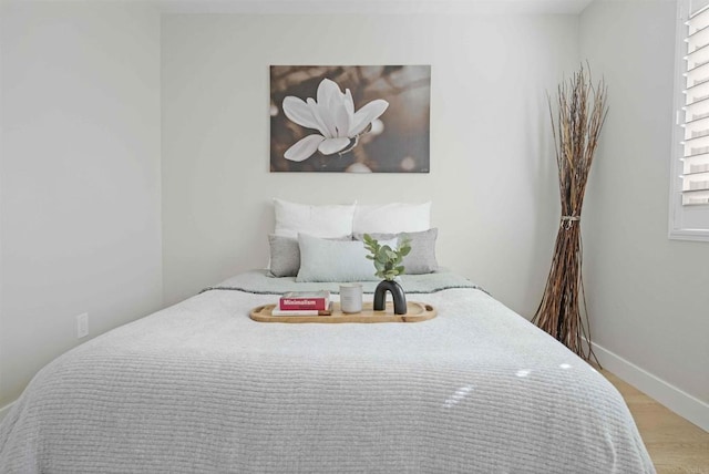 bedroom with light wood-type flooring