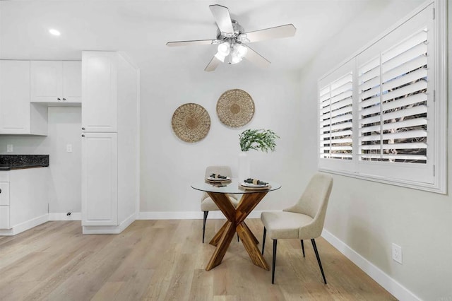 dining room featuring ceiling fan and light hardwood / wood-style flooring